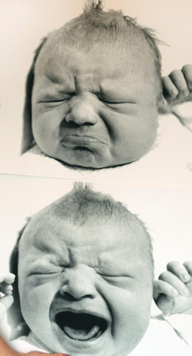 Das Schwarz-Weiß-Foto zeigt den Gesichtsausdruck eines weinenden Babys.