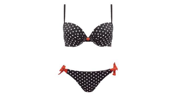 Ein schwarzer Bikini mit weißen Punkten und roten Schleifen.