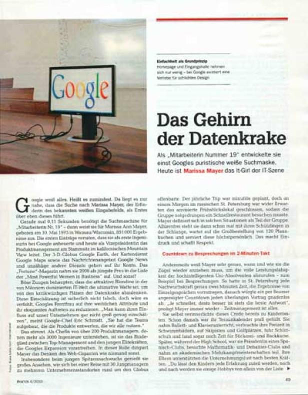 Ein Google-Logo ist auf einem Computerbildschirm auf einem Schreibtisch zu sehen.