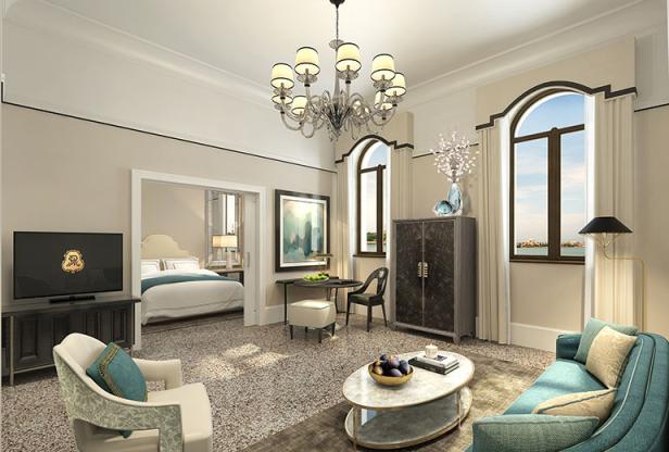 Ein luxuriöses Hotelzimmer mit Wohnbereich und Blick auf ein Schlafzimmer.