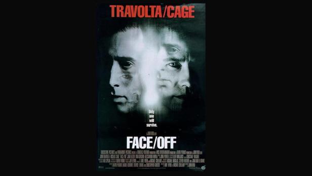Das Filmplakat für „Face/Off“ zeigt die verschmolzenen Gesichter von John Travolta und Nicolas Cage.