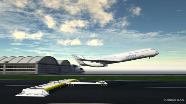 Ein Airbus-Konzeptflugzeug startet von einer Landebahn vor Hangars.