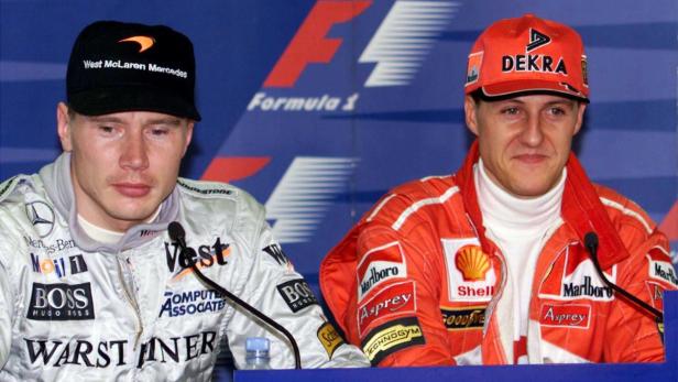 Mika Häkkinen und Michael Schumacher bei einer Pressekonferenz der Formel 1.