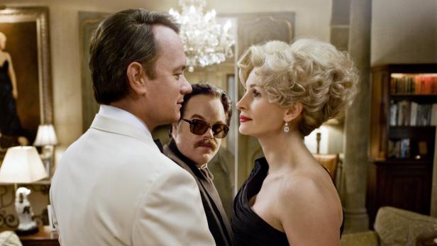 Tom Hanks, Philip Seymour Hoffman und Julia Roberts in einer Szene aus „Charlie Wilson's War“.