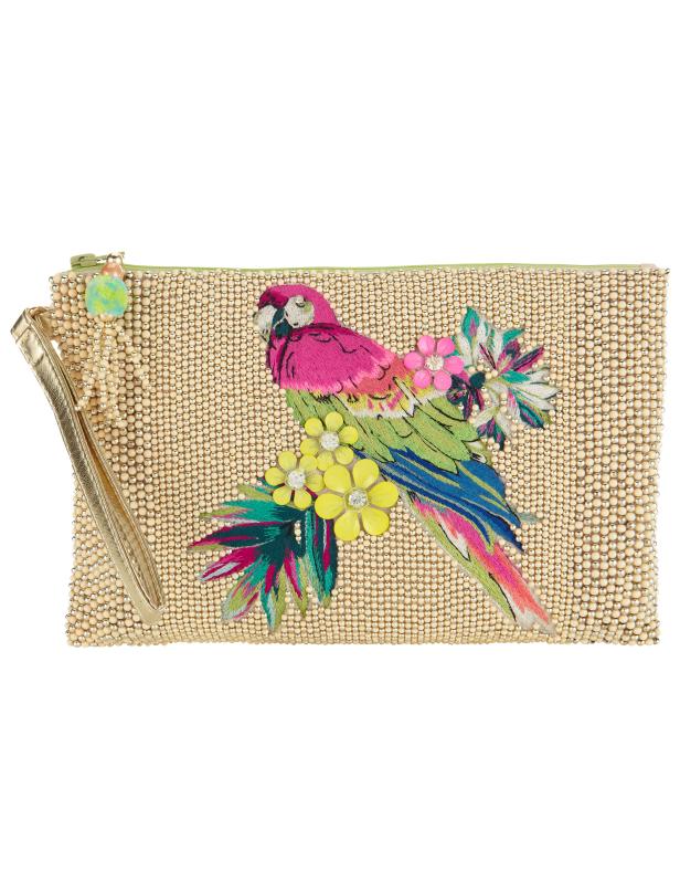 Eine mit Perlen besetzte Handtasche mit einer bunten Papageienapplikation.