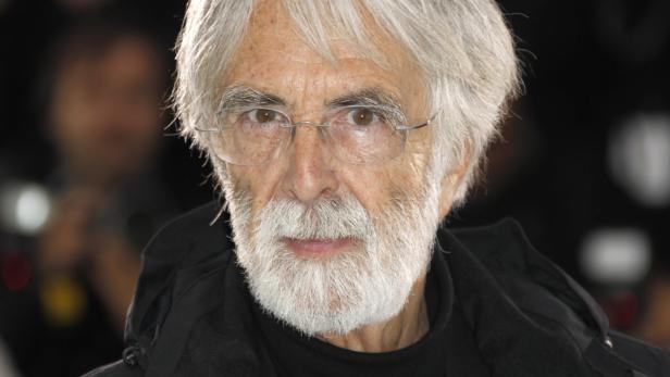 Nahaufnahme des Regisseurs Michael Haneke mit Brille und grauem Bart.