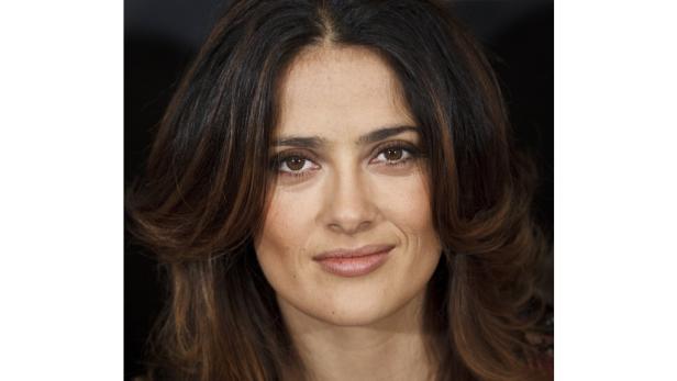 Porträt von Salma Hayek mit braunem, gewelltem Haar.