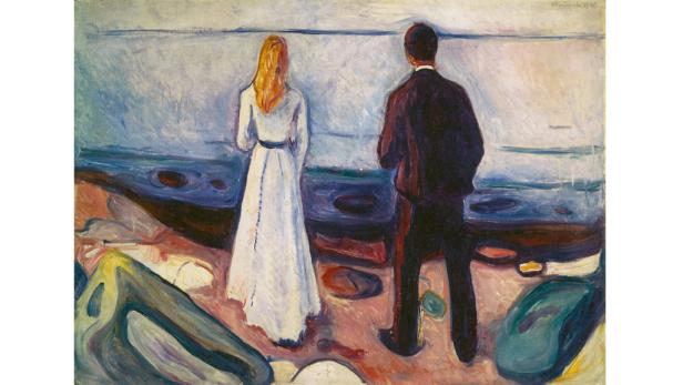 Das Gemälde „Das einsame Paar“ von Edvard Munch zeigt ein Paar am Ufer, das aufs Meer blickt.
