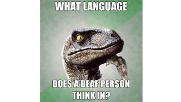 Ein Dinosaurier im Meme-Stil fragt, in welcher Sprache eine gehörlose Person denkt.