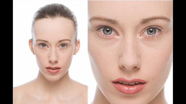 Das Gesicht einer jungen Frau mit hellen Augen und rosafarbenen Lippenstifts in Nahaufnahme.