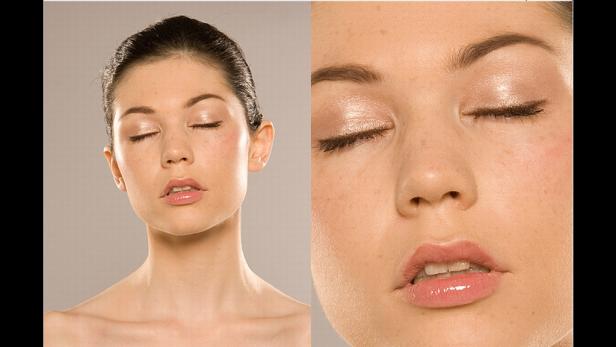 Das Gesicht einer Frau mit geschlossenen Augen und glänzendem Make-up.