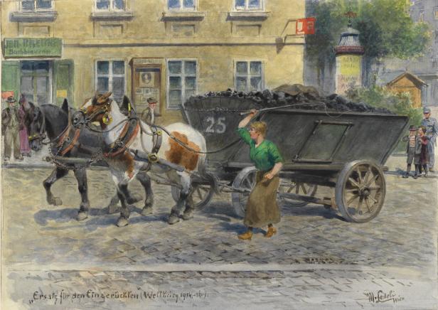 Eine Frau führt einen von zwei Pferden gezogenen Kohlenwagen durch eine Stadt.