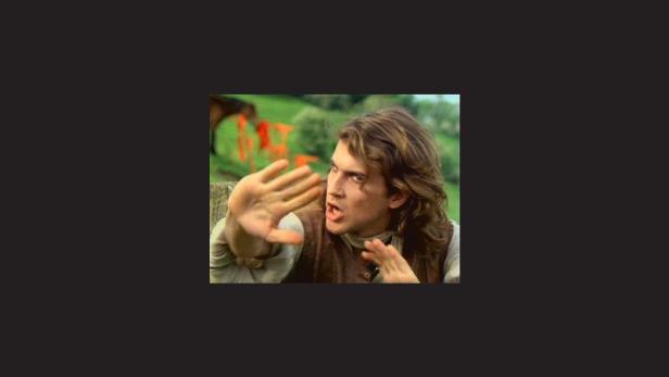 Ashton Kutcher in seiner Rolle als Walter in „Butterfly Effect“ wehrt etwas ab.