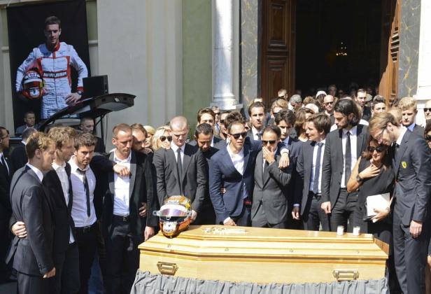 Friends and Formula One drivers gather around the