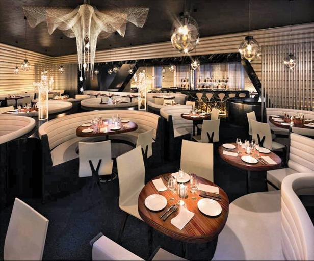 Ein elegantes Restaurant mit runden Tischen und weißen Sitzbänken.