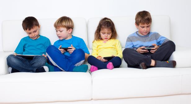 Children playing games on cellphones