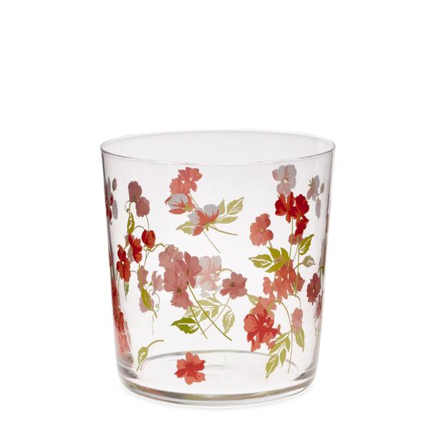 Ein transparentes Glas mit einem roten Blumenmuster.