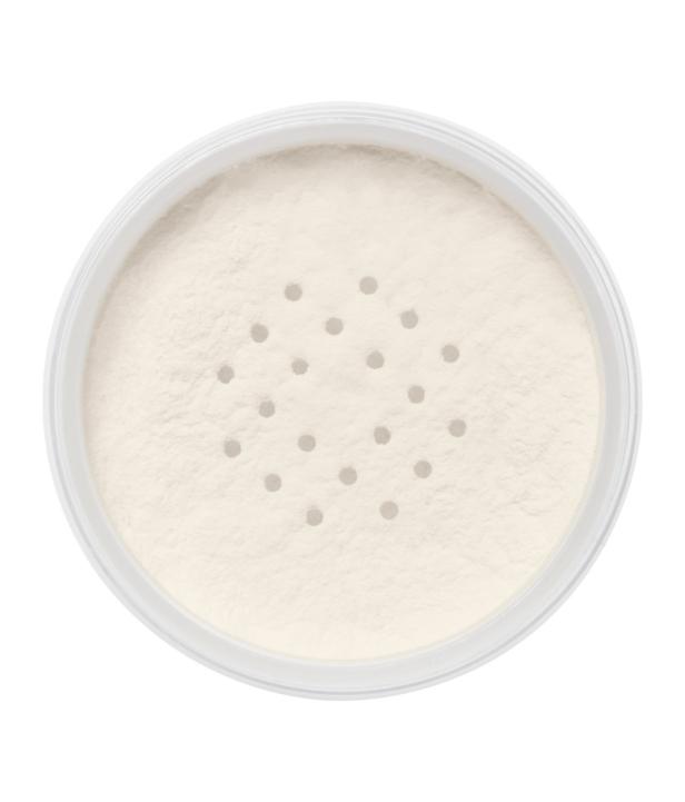 Ein geöffneter Behälter mit losem, hellem Puder, der durch kleine Löcher sichtbar ist.