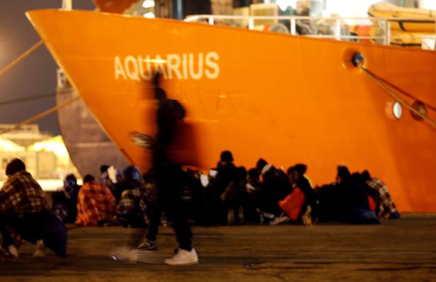 FILE PHOTO: Migrants disembark from the MV Aquarius after its arrivalgen in Sicily in January