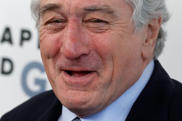 Actor Robert De Niro laughs as he arrives to receive his Chaplin Award from the Film Society of Lincoln Center in the Manhattan borough of New York
