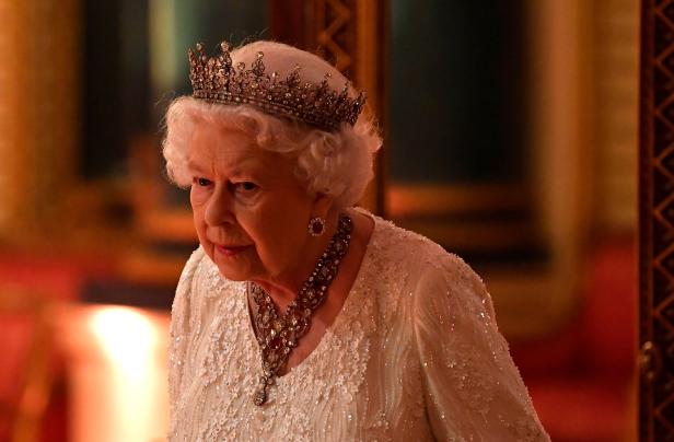Britain's Queen Elizabeth arrives to The Queen's Dinner during the Commonwealth Heads of Government Meeting at Buckingham Palace in London, Britain