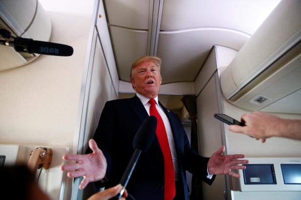 U.S. President Donald Trump speaks to the press aboard Air Force One en route to Bedminster, New Jersey, from Joint Base Andrews
