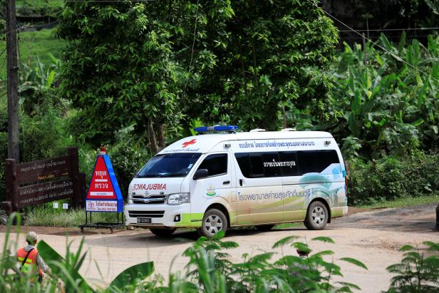 An ambulance leaves from Tham Luang cave complex  in the northern province of Chiang Rai