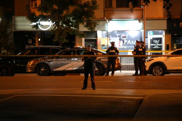 Police are seen near the scene of a mass shooting in Toronto