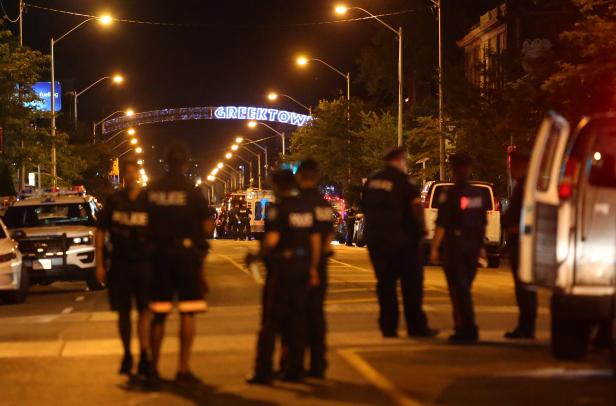 Police are seen near the scene of a mass shooting in Toronto