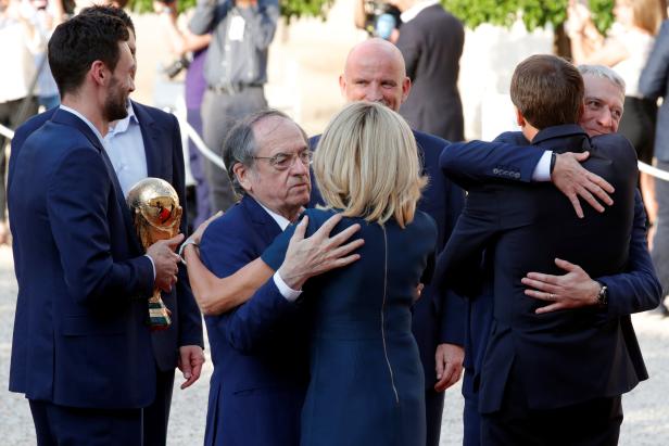 Brigitte Macron and French President Emmanuel Macron, greet guests before a reception to honour the France soccer team after their victory in the 2018 Russia Soccer World Cup, in Paris