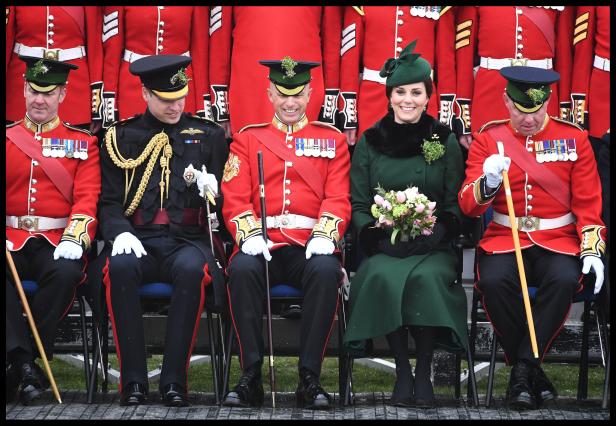 Britain's Catherine, Duchess of Cambridge and Prince Wiliam, pose for a group photograph as they attend the presentation of Shamrock to the 1st Battalion Irish Guards, at a St Patrick's Day parade at Cavalry Barracks in Hounslow, London