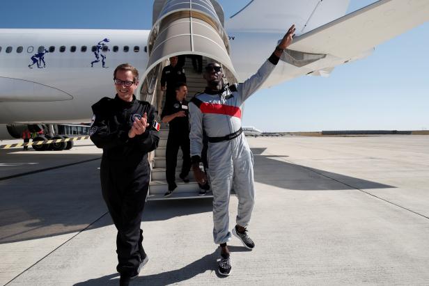 Retired sprinter Usain Bolt and Quentin Meurisse from Martell Mumm Perrier-Jout after they enjoyed zero gravity conditions during a flight in a specially modified Airbus Zero-G plane above Reims