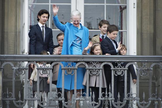 Denmark's Queen Margrethe waves from the balcony together with her grandchildren