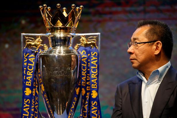 FILE PHOTO -  Vichai Srivaddhanaprabha, owner of football club Leicester City, stands on stage next to the club's English Premier League trophy during a meeting with the media in Bangkok