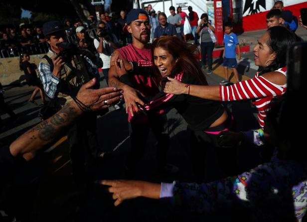 Demonstrators clash during a protest against migrants from Central America in Tijuana