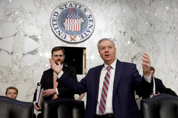 Senate Judiciary Committee Chairman Lindsey Graham (R-SC) greets witnesses  before the Committee nomination hearing for William Barr