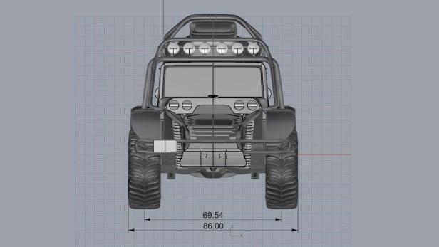 Eine Frontansicht eines Offroad-Fahrzeugs mit Überrollkäfig und Zusatzscheinwerfern.