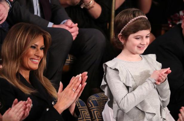First lady Melania Trump applauds with cancer survivor Grace Eline as U.S. President Trump delivers his second State of the Union address to a joint session of the U.S. Congress in Washington