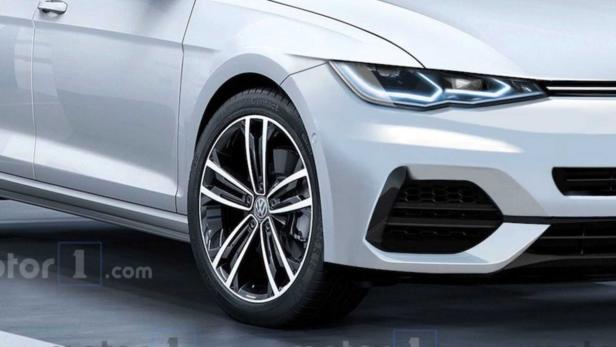 Detailansicht der Frontpartie eines weißen Volkswagen Golf mit markanten Felgen.