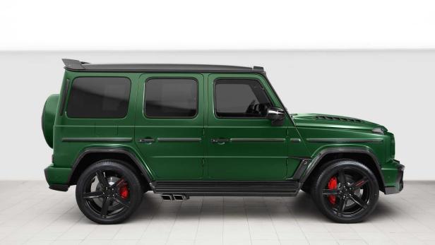 Ein grüner Mercedes-Benz G-Klasse Geländewagen, seitliche Ansicht.