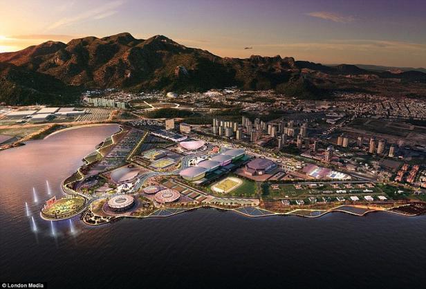 Eine Luftaufnahme des Olympiaparks mit Bergen und einer Stadt im Hintergrund.