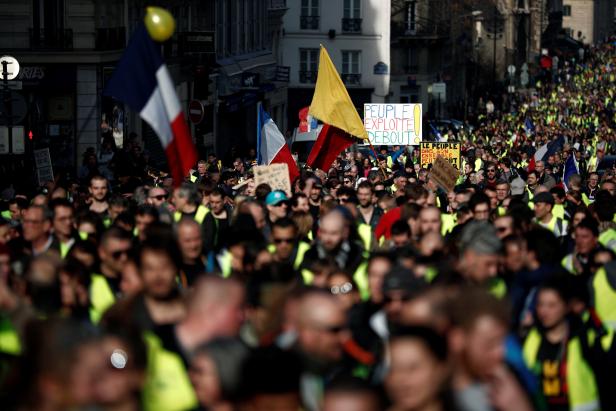 Protesters wearing yellow vests take part in a demonstration of the "yellow vests" movement in Paris