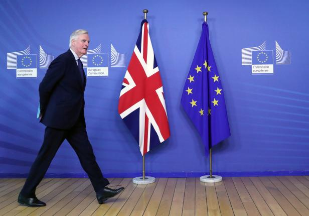 FILE PHOTO: EU Chief Brexit Negotiator Barnier walks at EC HQ in Brussels