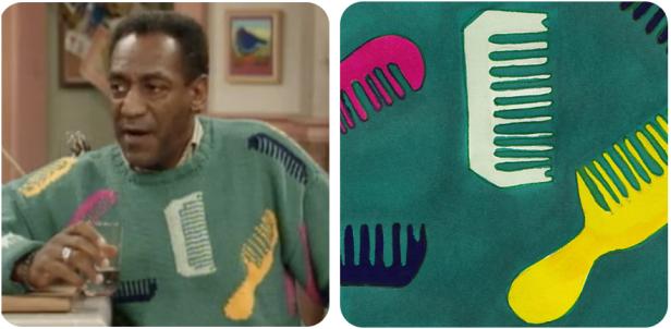 Ein Mann mit einem bunten Pullover mit Kamm-Motiven hält ein Glas.