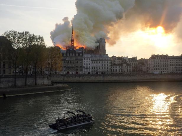 Smoke billows from the Notre Dame Cathedral after a fire broke out, in Paris