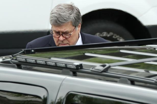 U.S. Attorney General Barr walks to his car after a cabinet meeting with Trump at the White House in Washington