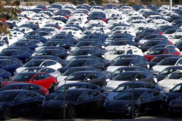FILE PHOTO: A parking lot of predominantly new Tesla Model 3 electric vehicles is seen in Richmond
