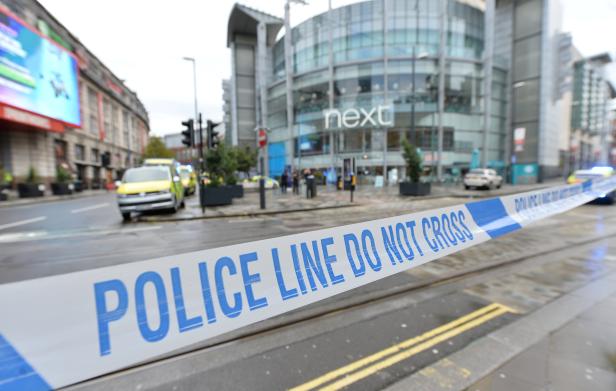 Police tape is seen outside the Arndale shopping centre after several people were stabbed in Manchester