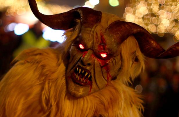 A person costumed as Krampus or Percht, figures from ancient Austrian custom, performs during a Perchten run in Vienna