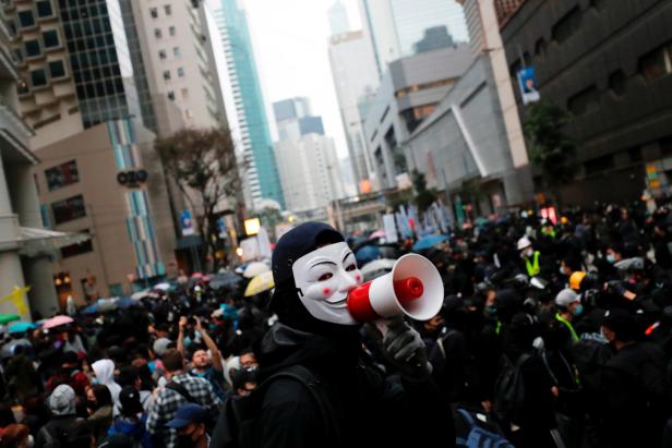 Anti-government protesters march during a demonstration on the New Years Day to call for better governance and democratic reforms in Hong Kong